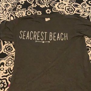A grey shirt that says “Seacrest Beach”